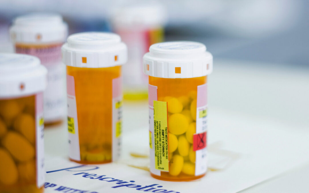 Multiple pill bottles in varying stages to refill